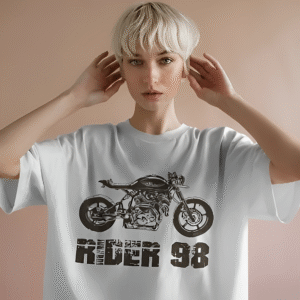 Woman wearing Rider 98 Unisex Oversized Classic T-Shirt featuring a detailed black motorcycle graphic and bold distressed lettering – vintage biker streetwear by Mondrang